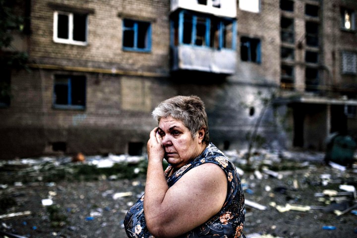 TOPSHOTS A woman reacts after shelling i...TOPSHOTS A woman reac