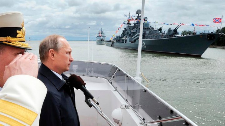 Russian President Vladimir Putin, second left, reviews a Navy parade in Baltiisk, western Russia, Sunday, July 26, 2015 during celebrations for Russian Navy Day. (Mikhail Klimentyev/RIA-Novosti, Kremlin Pool Photo via AP)
