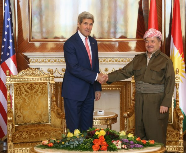 Kurdish Regional Government President Massoud Barzani (R) shakes hands with U.S. Secretary of State John Kerry (L) in Arbil, in Iraq's Kurdistan region June 24, 2014. Kerry was in Iraqi Kurdistan on Tuesday to urge its leaders not to withdraw from the political process in Baghdad after their forces took control of the northern oil city of Kirkuk. Peshmerga fighters, the security forces of Iraq's autonomous Kurdish north, seized control of Kirkuk on June 12 after the Iraqi military fled in the face of an onslaught from Sunni militants from the Islamic State in Iraq and the Levant (ISIL). REUTERS/Stringer (IRAQ - Tags: POLITICS)